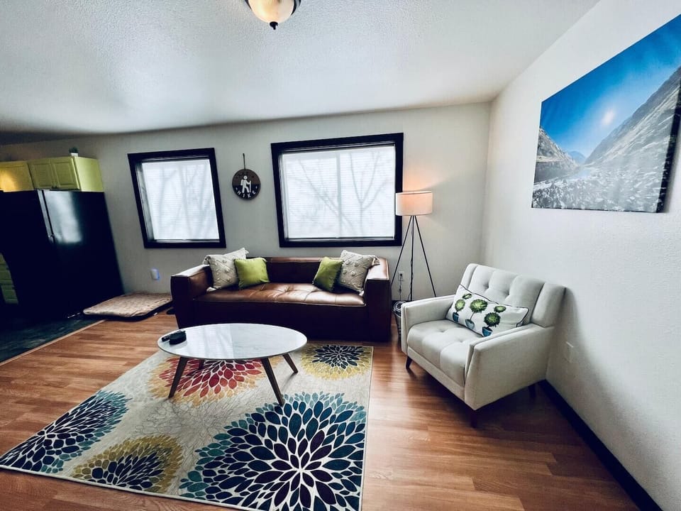 There is also a comfortable chair next to the sofa