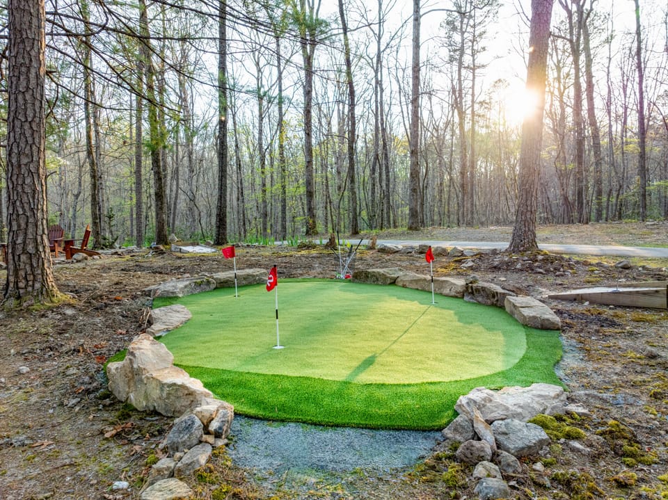 Enjoy outdoors with putting green, horse shoe, corn hole and firepit