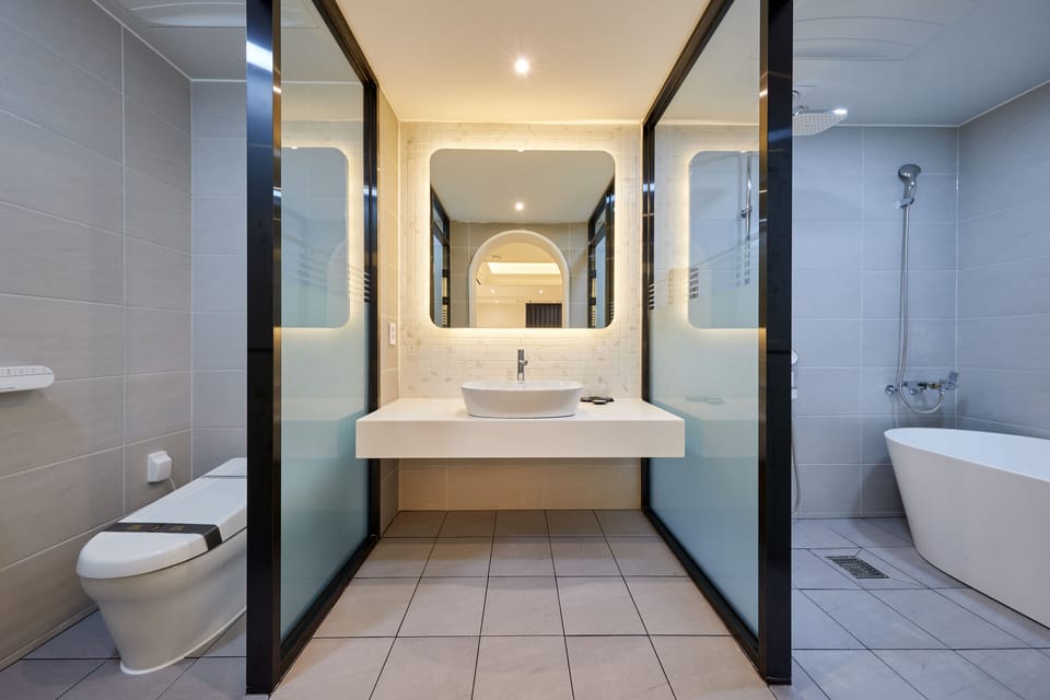 Signature Twin Room | Bathroom | Hair dryer, bathrobes, bidet, towels