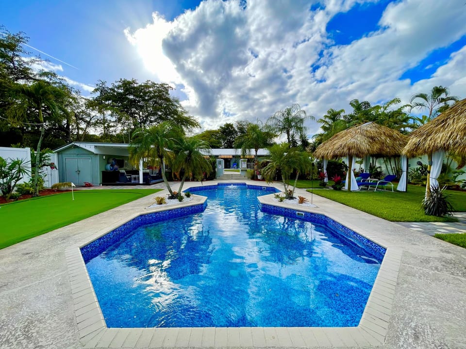 Sparkling blue water in the heated salt water pool, as seen from Gecko Bar Tiki.