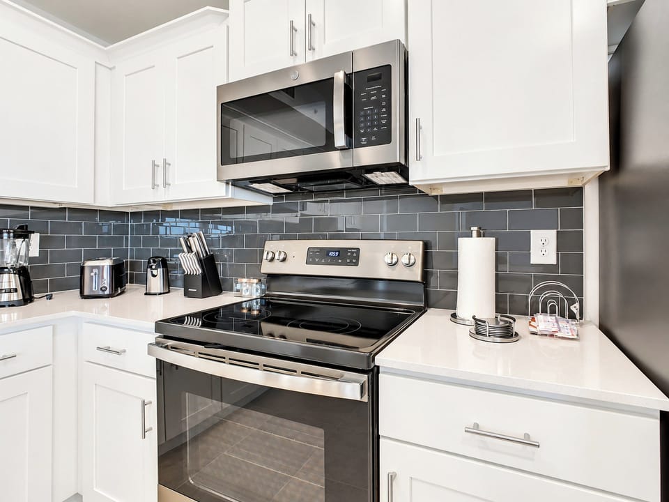Modern Kitchen with Stainless Steel Appliances and Subway Tile
