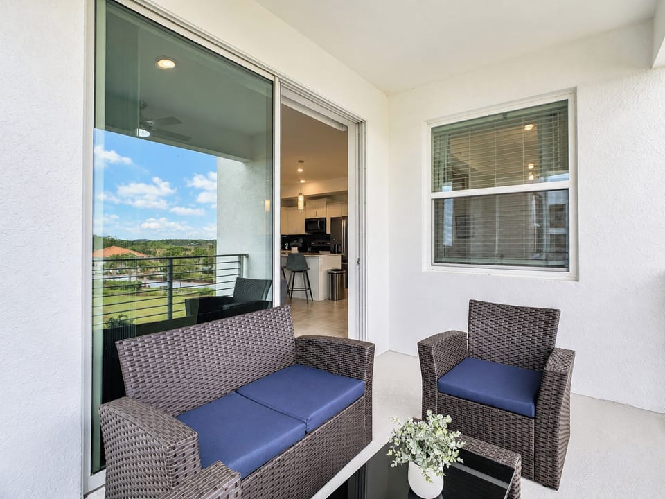 Private Balcony with Comfortable Outdoor Wicker Seating