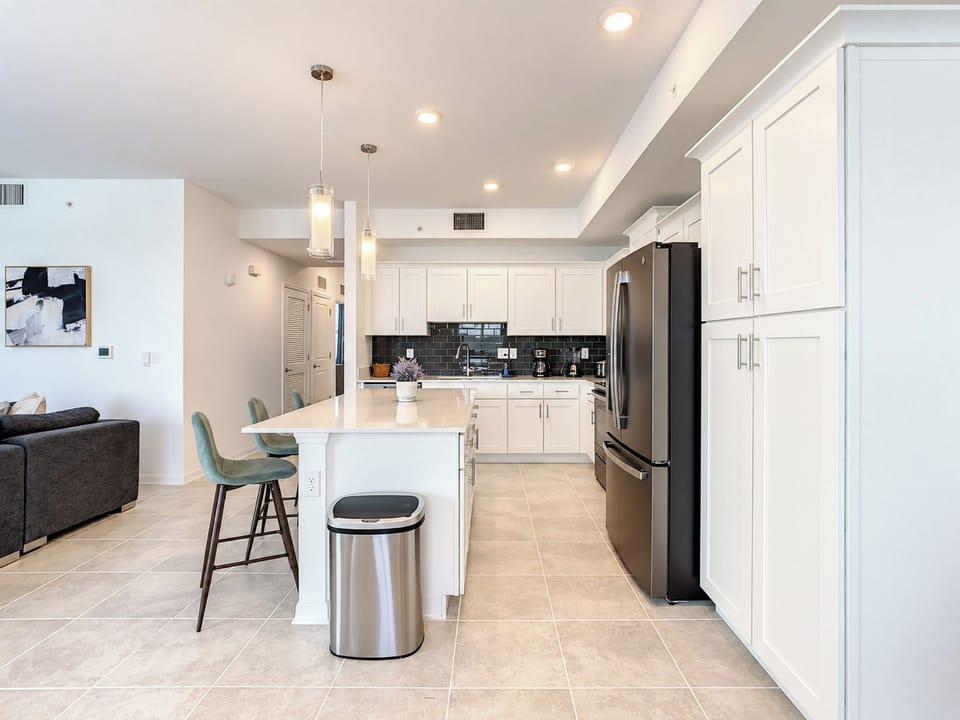 Modern Kitchen with Island Breakfast Bar and Sleek Appliances