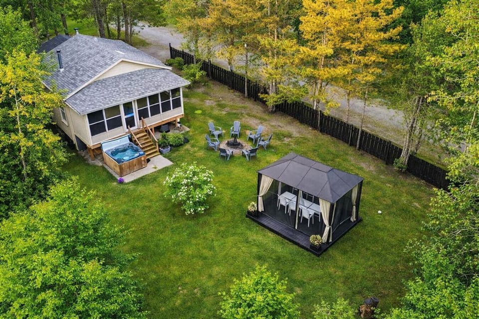 Aerial view of the property surrounded by nature and greenery.