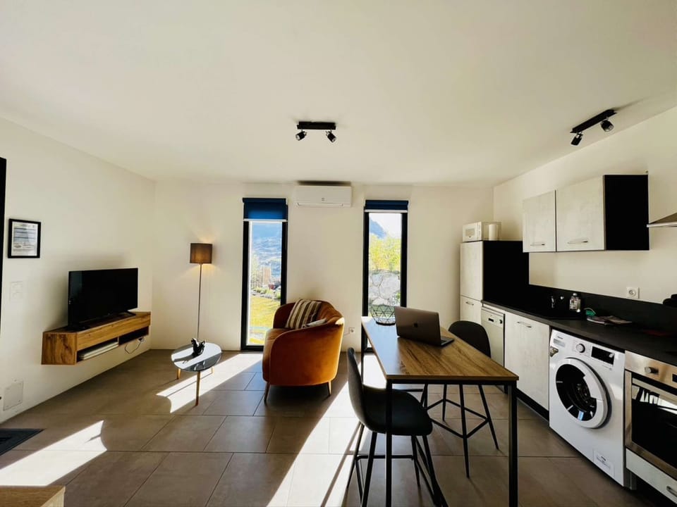 view of fitted kitchen, dining table, tv lounge