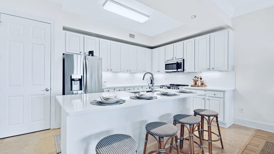 Beautiful large white quartz countertop island seats 4.