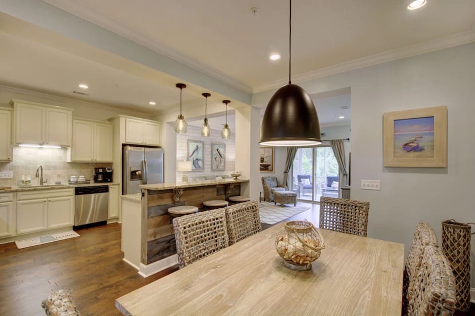 A beach themed dining room and table that accommodates up to six.