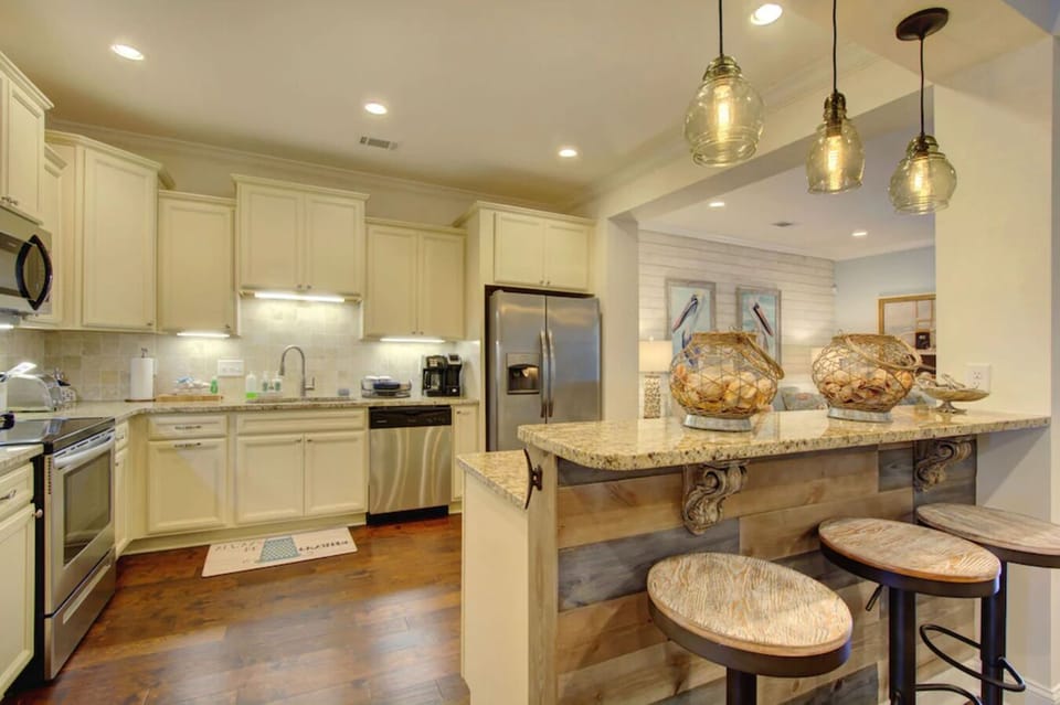 A full equipped kitchen with new appliances perfect for making a gourmet meal.