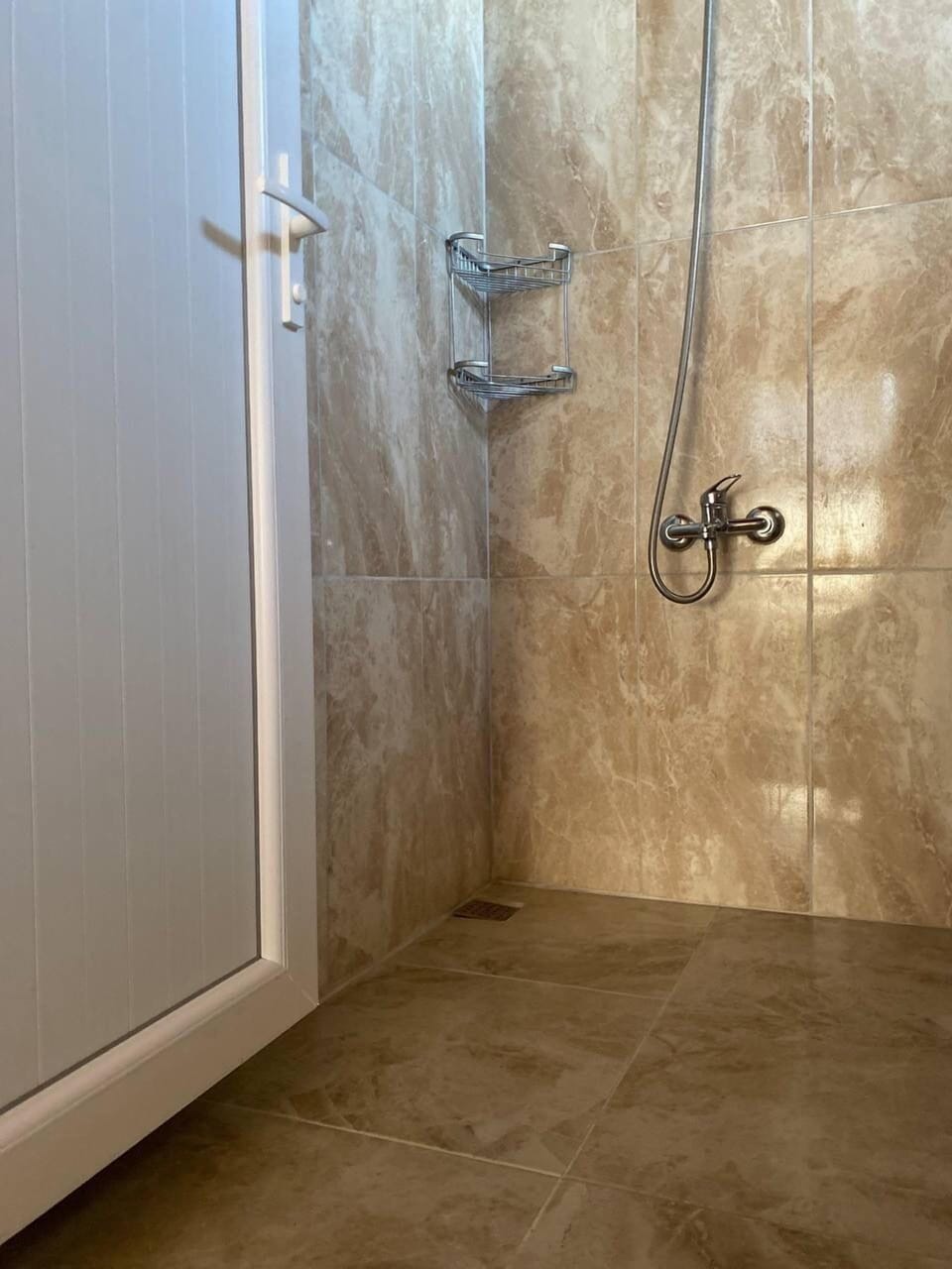 Shower, hair dryer, towels, toilet paper
