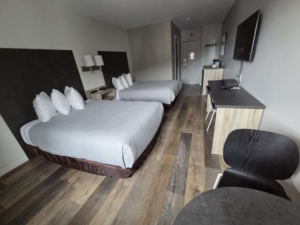 Premium bedding, blackout drapes, iron/ironing board, free WiFi