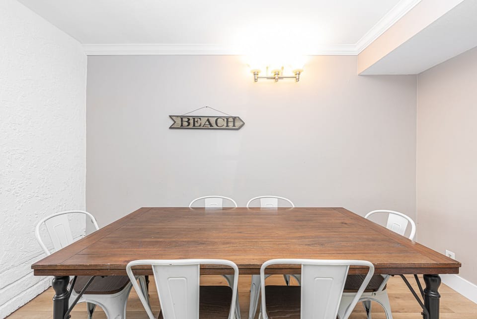 The dining table, located off of the main living area and kitchen, seats 6.
                