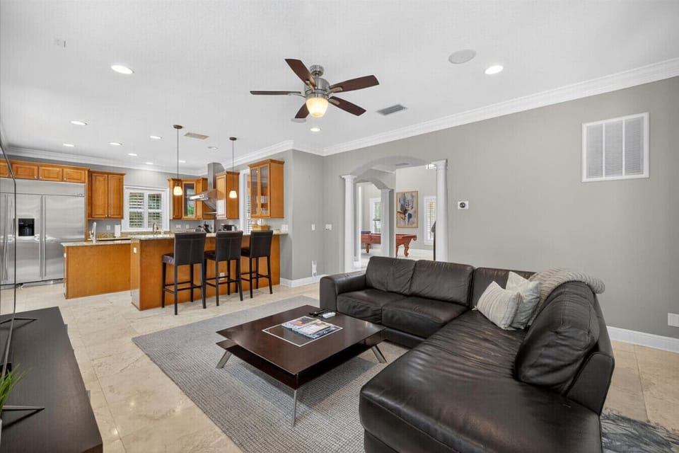 Bright, airy living room with open flow to the kitchen—perfect for gathering with family and friends