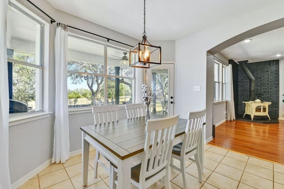 Bright dining area with large windows—perfect for family meals and soaking in the Texas countryside.