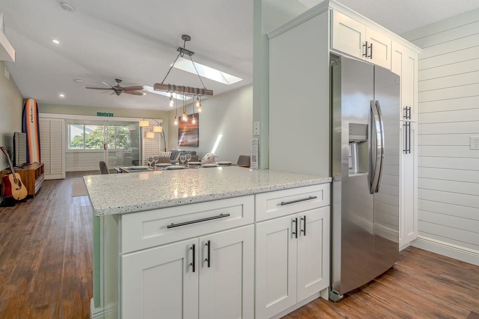 Fully Equipped Stainless Steel Kitchen w/ Bar Seating