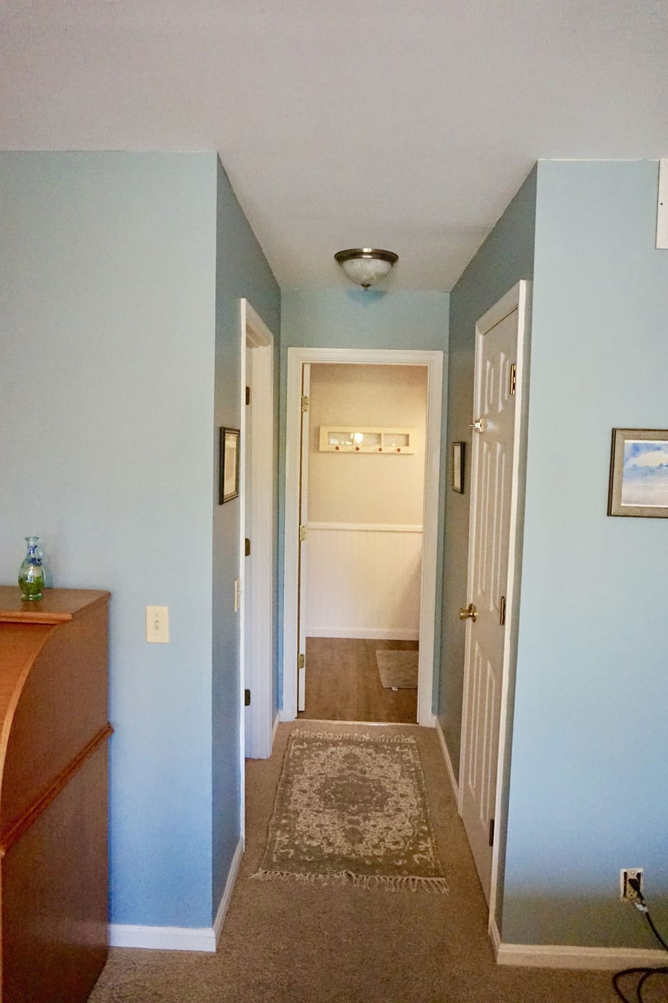 Hallway to MBR bathroom with walk in closet.