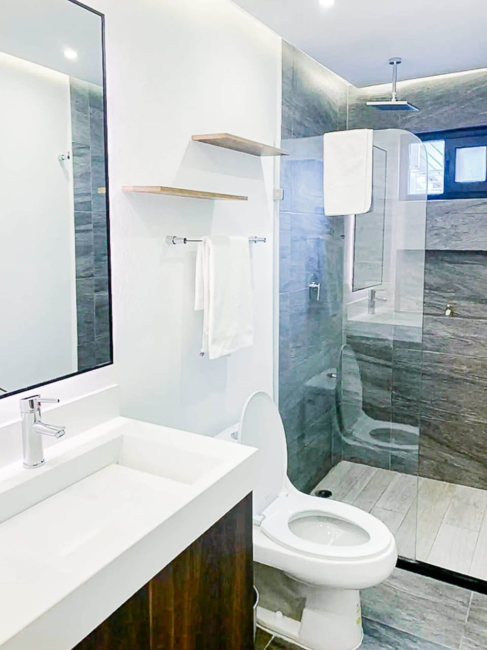 Convenient bathroom with sink and toilet, providing comfort and privacy in Playa del Carmen