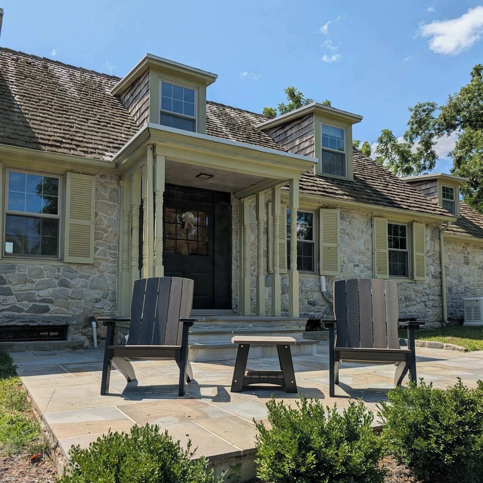 Downingtown Manor is a 1900's farmhouse sitting on 2.6 acres of scenic land overlooking the Brandywine creek.