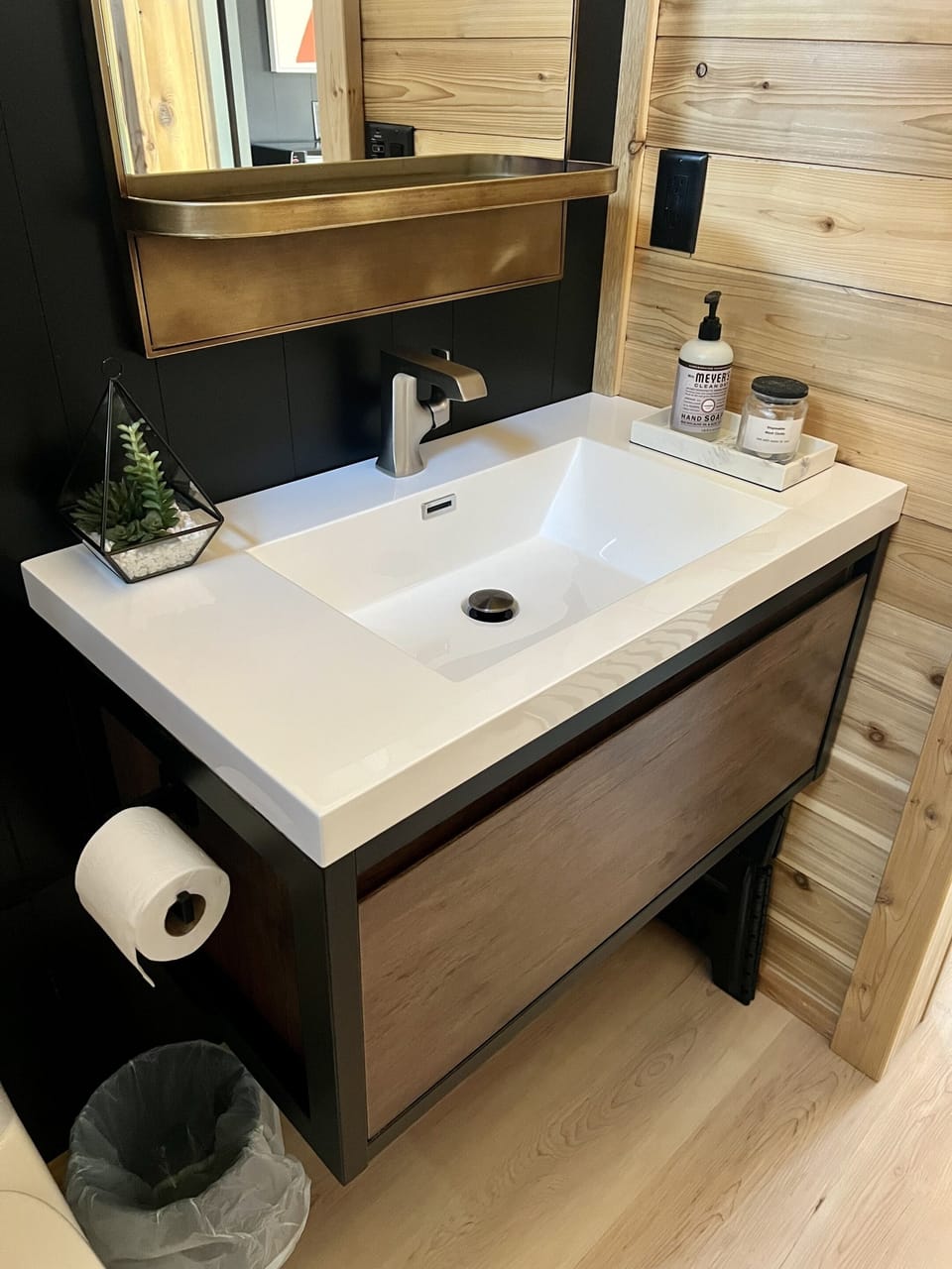 The bathroom is spacious with a large vanity and sink.  