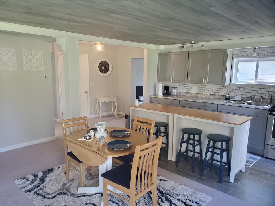 Looking toward kitchen and rear hallway toward den on the right