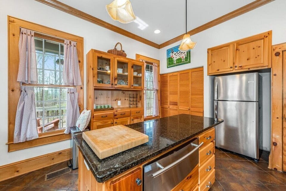 Plenty of spices, dishes, pots, pans, and appliances needed to prepare meals.