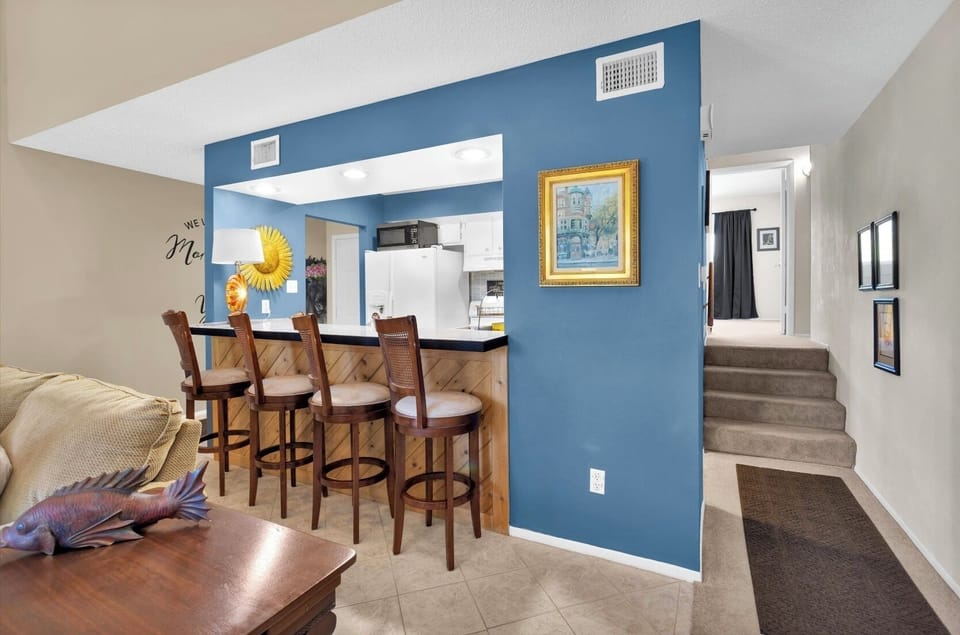 Extra dining seating on the open kitchen bar.