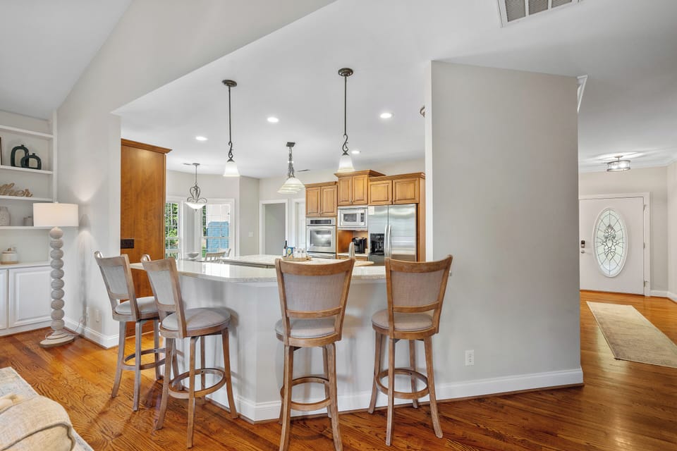 Fully stocked kitchen with island and bar seating for 4.