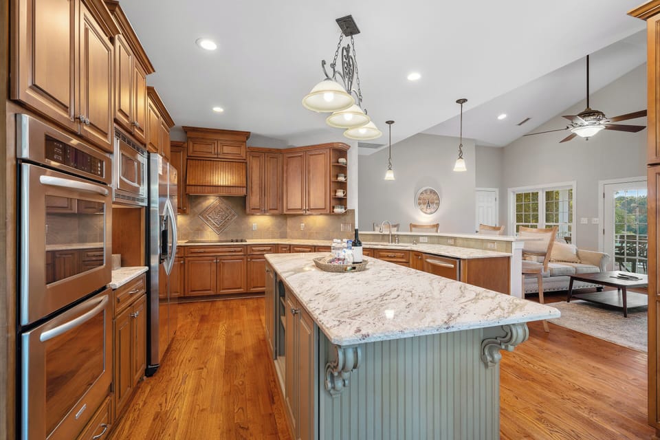 Fully stocked kitchen with island and bar seating for 4.
