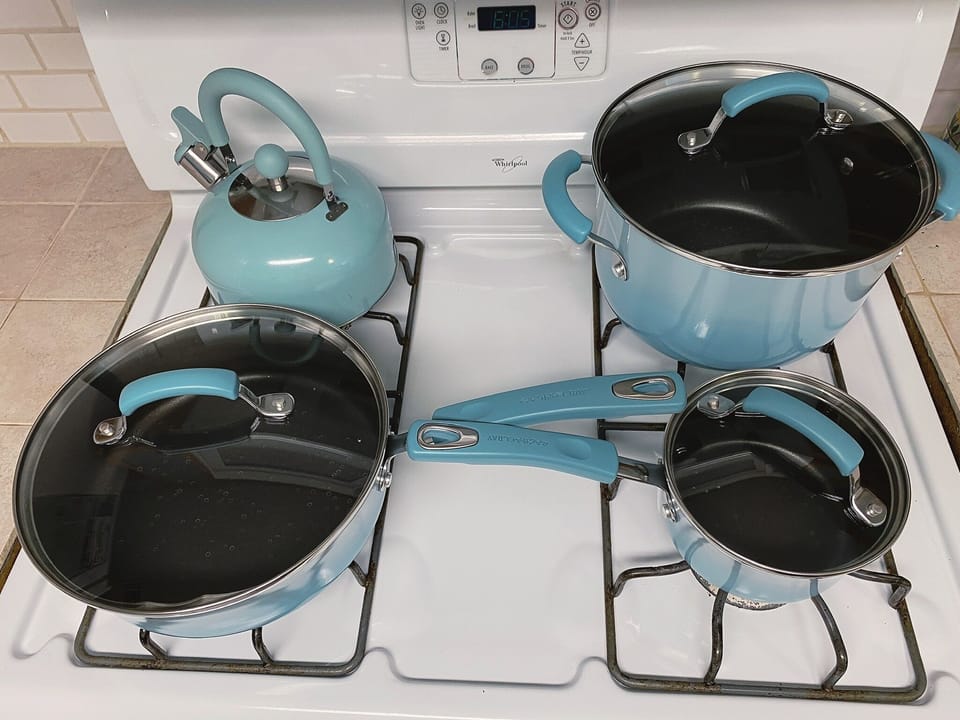 Fully stocked kitchen with quality cookware for family meals.