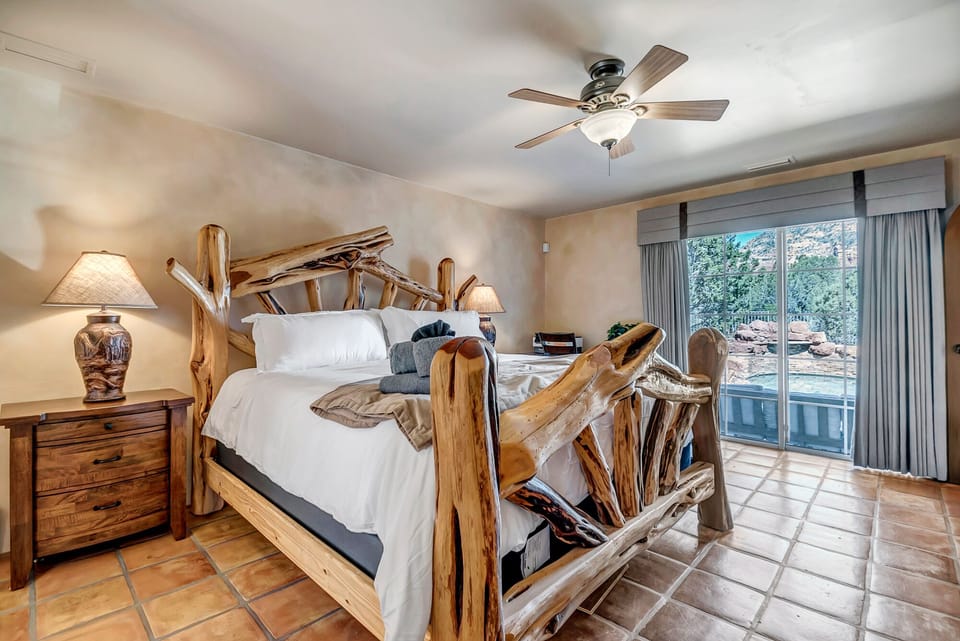 Master Bedroom with a King Bed, 40" Smart TV and Patio Access