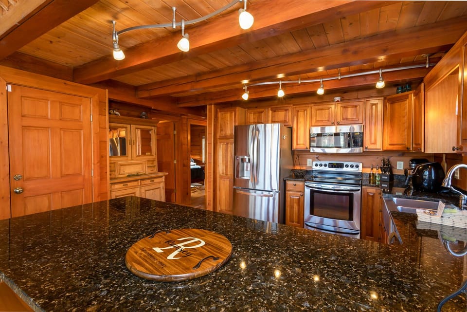 Generous Kitchen offers plenty of Cabinet and Countertop space to prepare and serve meals to a full house!
