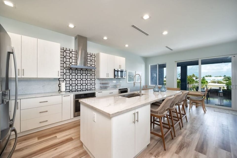 Fully stocked kitchen with utensils and appliances