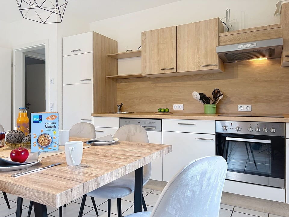 Furniture, Interior Design, Kitchen, Countertop, Flooring, Kitchen Appliance, Cabinetry, Wood, Floor, Room