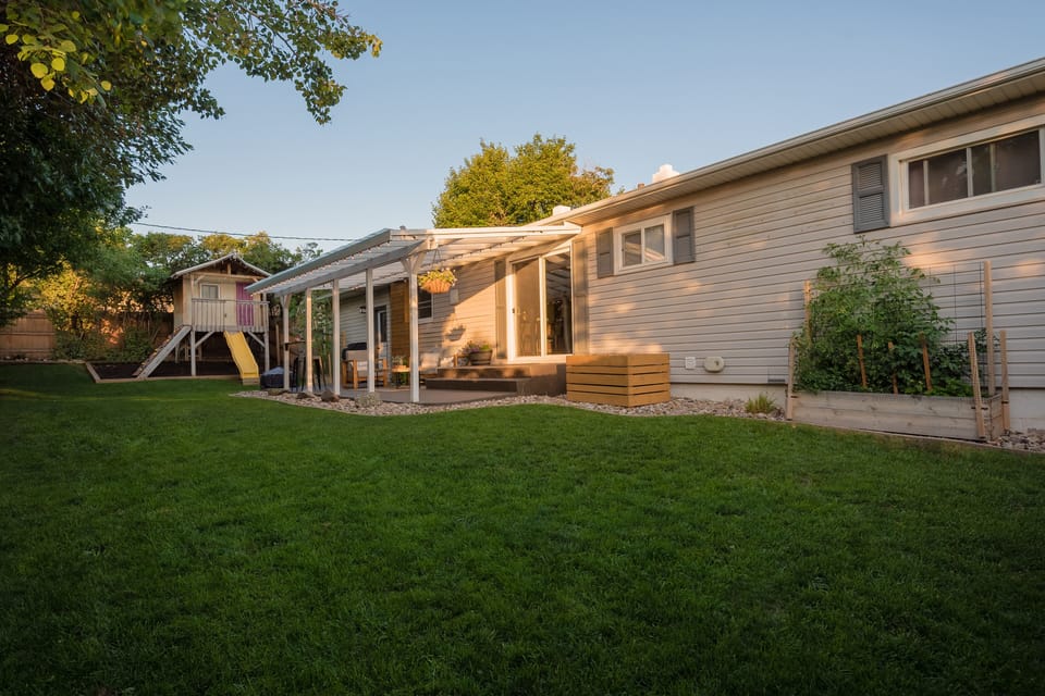 Fully fenced in backyard with the privacy of mature trees