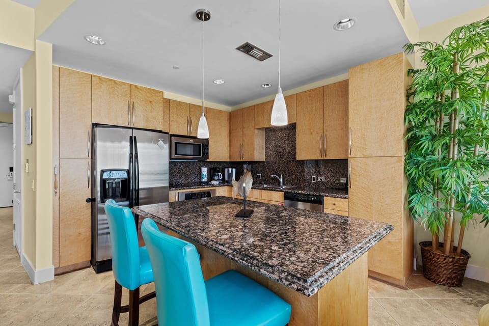 Amazing kitchen fully stocked with cooking utensils and stainless steel appliances!