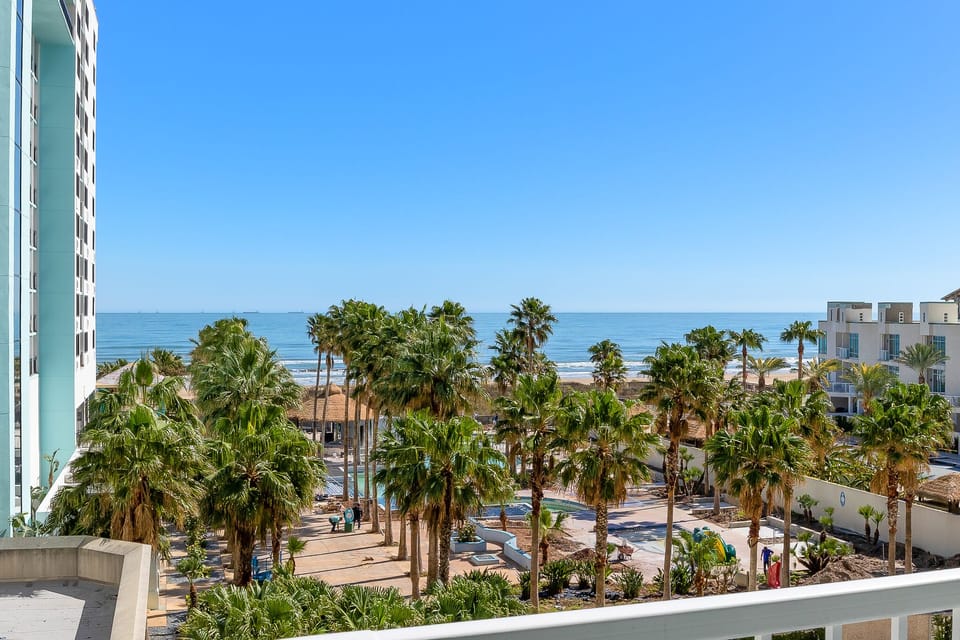 Enjoy the beautiful resort style scene looking out towards the beach from your balcony! Great ocean views from your private balcony!