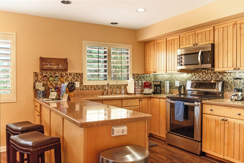 Fully equipped, bright & modern kitchen with views too!
