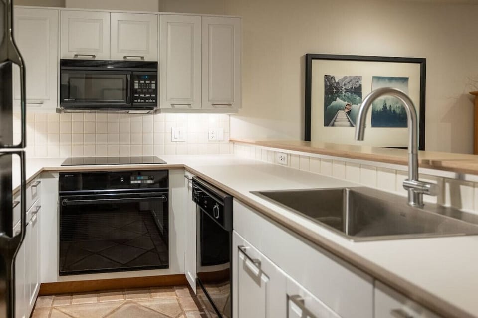 Fully equip kitchen with dishwasher, over the range extractor fan and microwave, fridge and freezer combo as well as an oven and stovetop! Cook all your meals here!