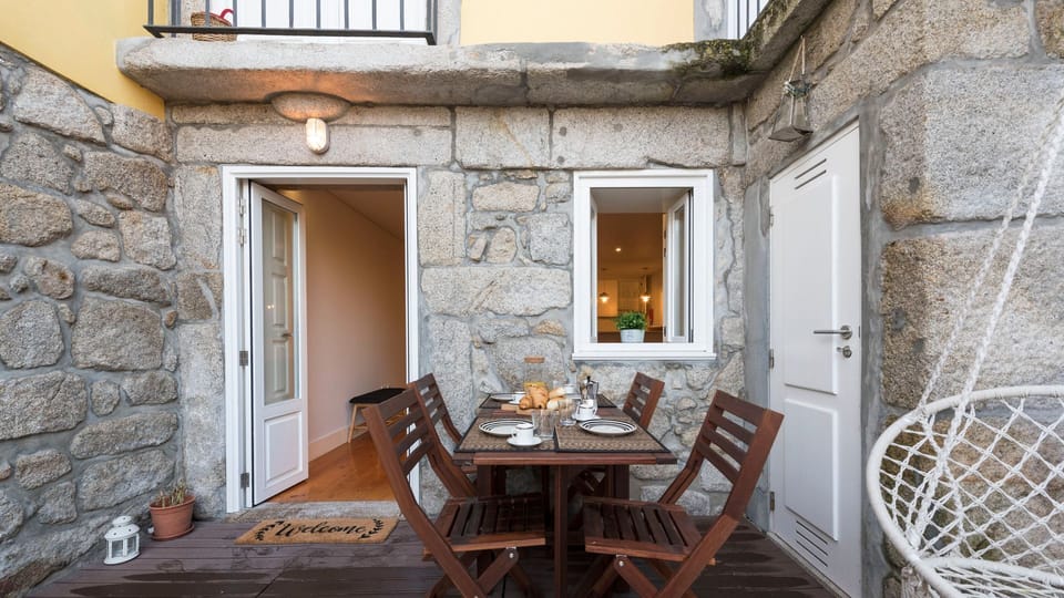 Enjoy alfresco dining or simply unwind with a refreshing drink on this charming stone patio, a private urban oasis.
#Patio #OutdoorDining #LovelyStay