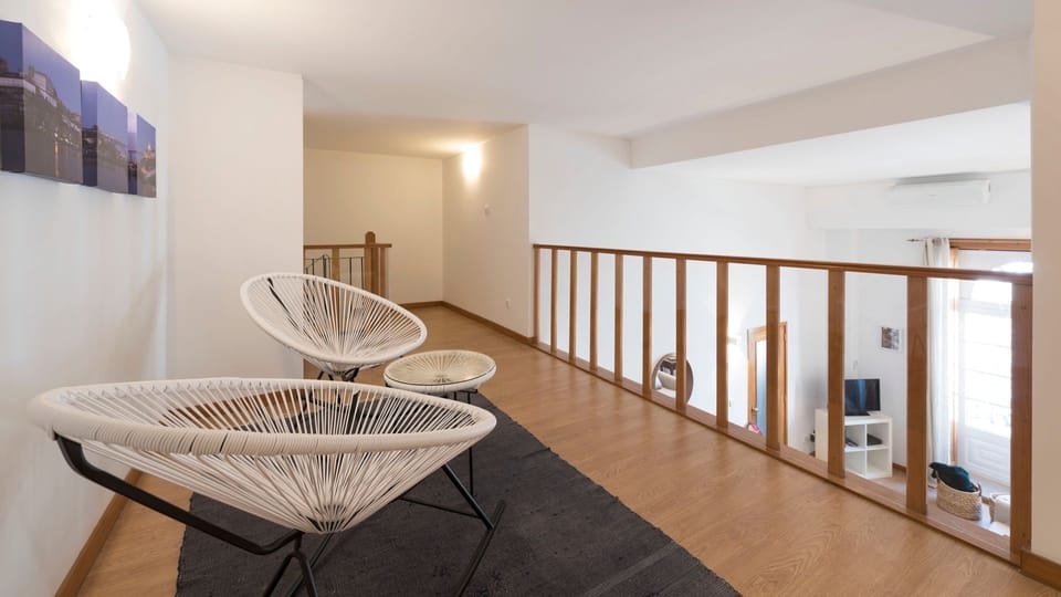 An open and airy upstairs landing with stylish seating, perfect for a quiet read or conversation.
#LoungeArea #OpenConcept #LovelyStay