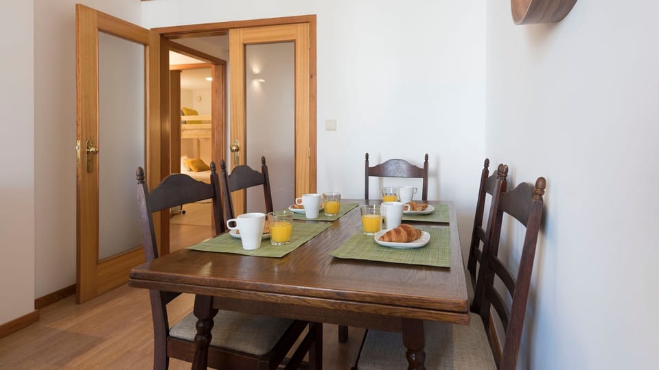 Enjoy delightful meals and shared moments around the traditional wooden dining table, complete with fresh breakfast settings.
#DiningArea #MealsTogether #LovelyStay