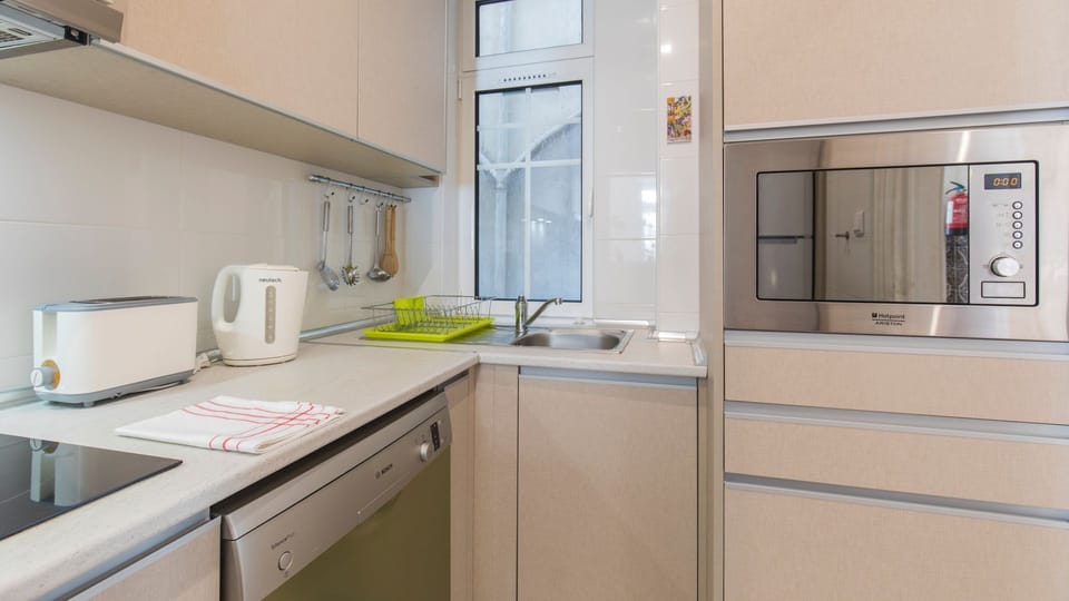 All key appliances provided such as a toaster, a kettle, a microwave and more! #airbnb #airbnblisbon #portugal #pt #lisbon