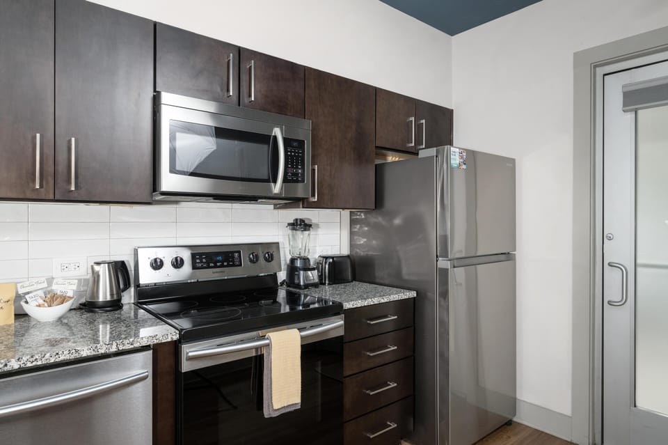 Modern kitchen with sleek stainless steel appliances and ample storage