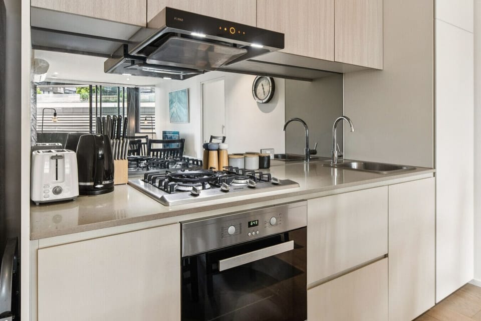 Everything you need to cook meals. Microwave, dishwasher and bins are all discreetly hidden behind cupboard doors.