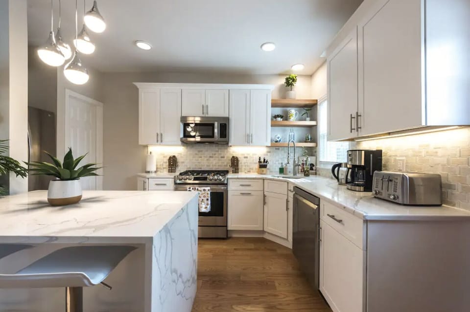 Brand-new kitchen and island table with seating for two.

