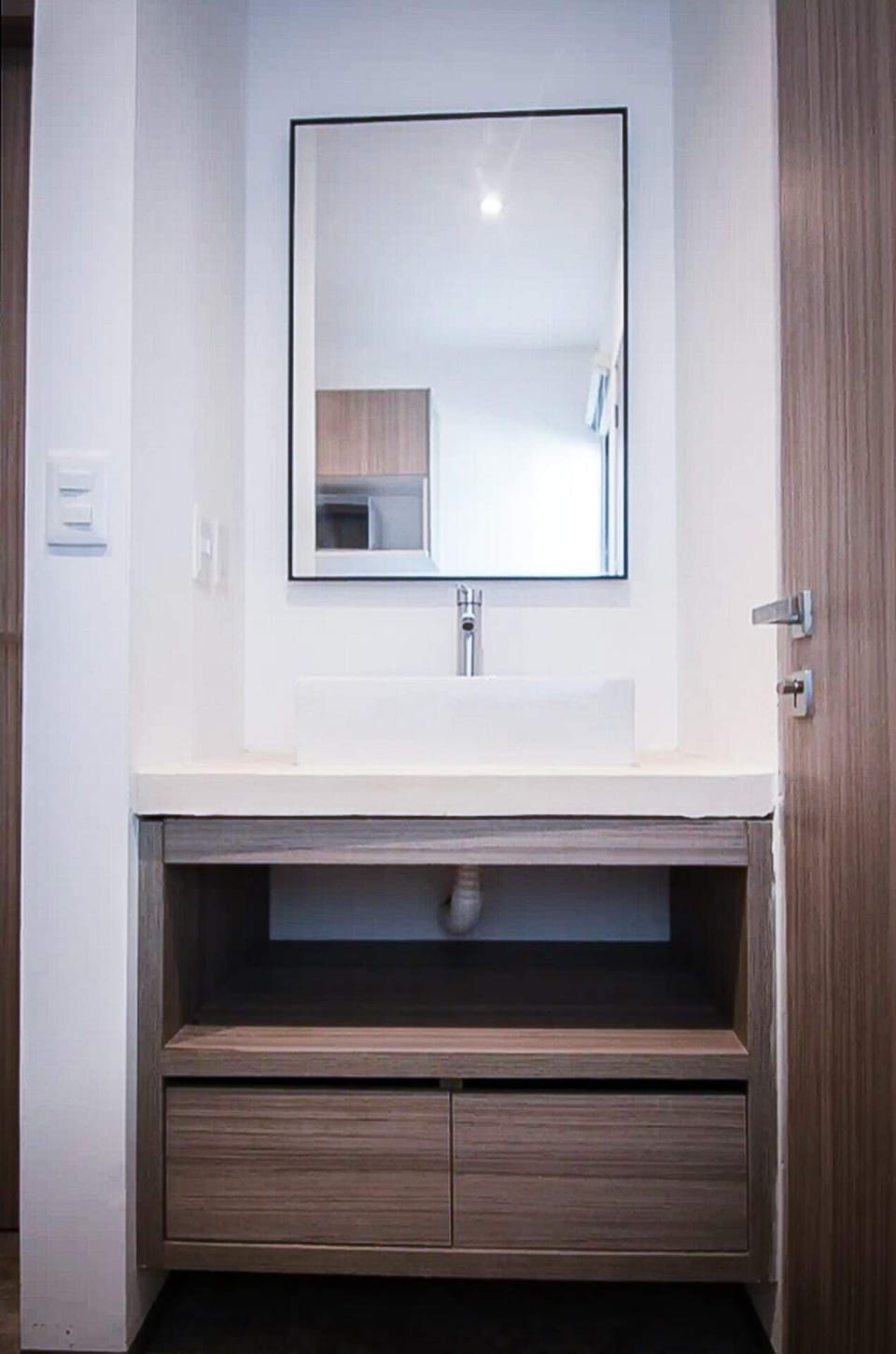 A luxurious bathroom featuring a mirror, perfect for pampering and self-care in Playa del Carmen.