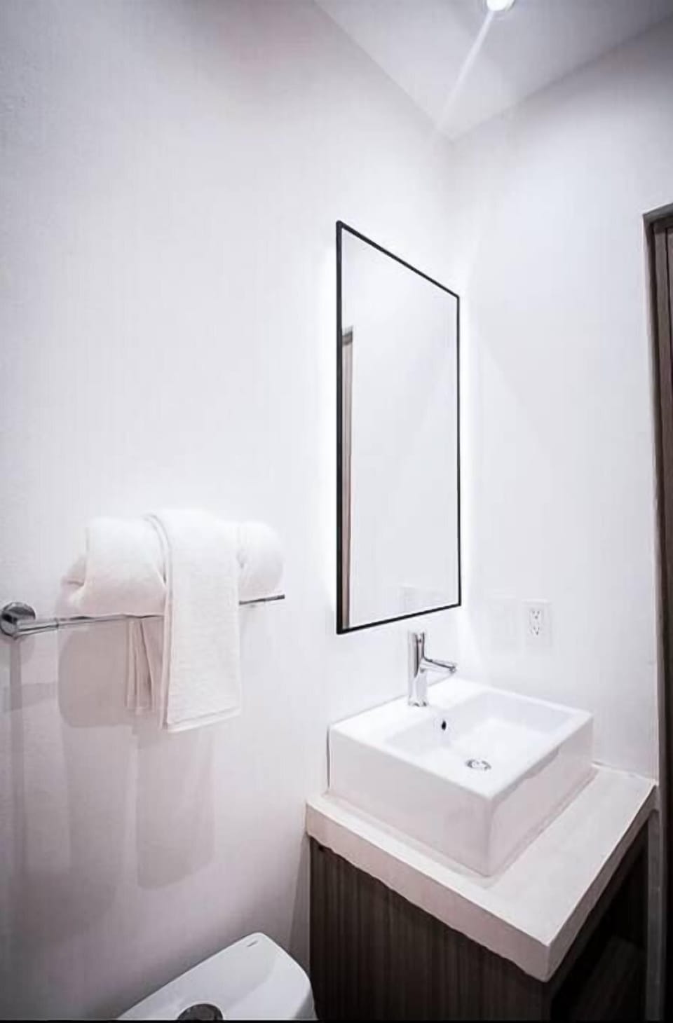 Sleek bathroom with mirror and sink