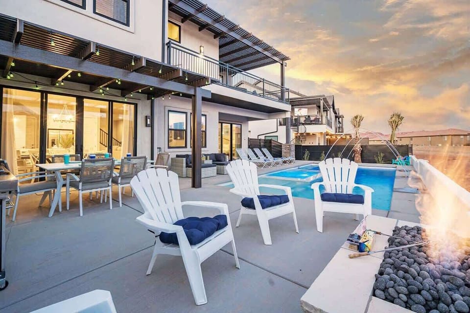 Private pool and patio dining with fire pit and chairs