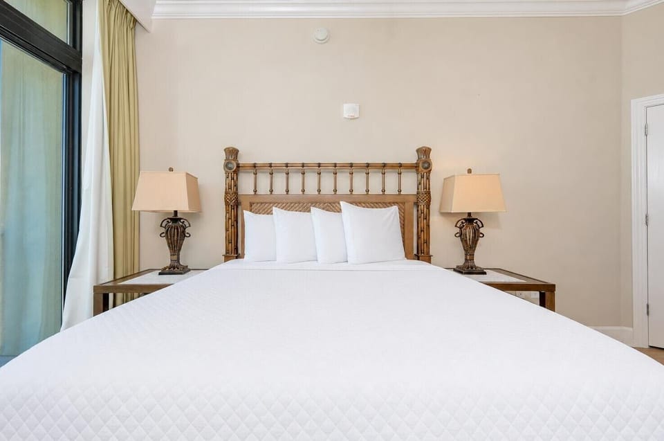 Sleep peacefully in soft queen bedding, waking to serene coastal views form your guest suite balcony