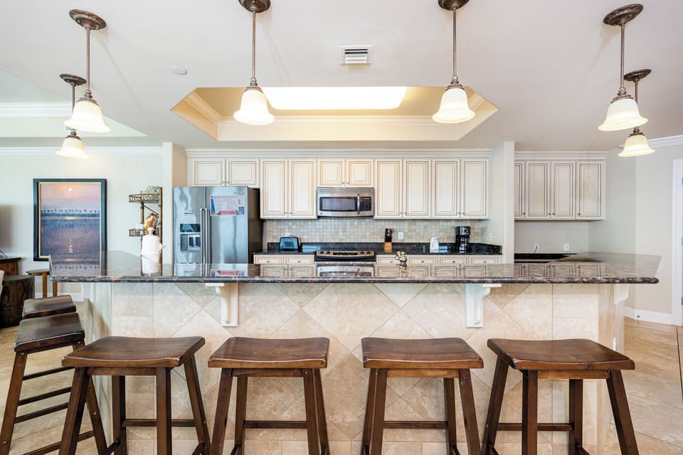Wake up with morning coffee at the breakfast bar and get ready for a beach day in this stylish space