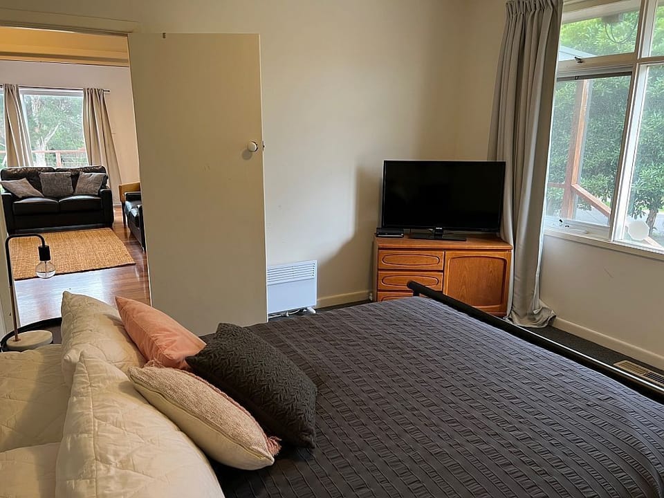 Bedroom 1 - Queen bed, TV/DVD player, fan, heater, wardrobe